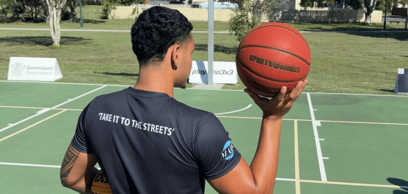 Man holding basketball. | Newsreel