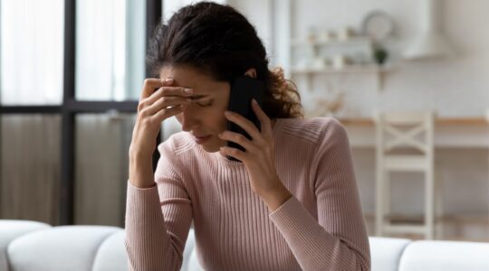 Sad woman on phone. | Newsreel