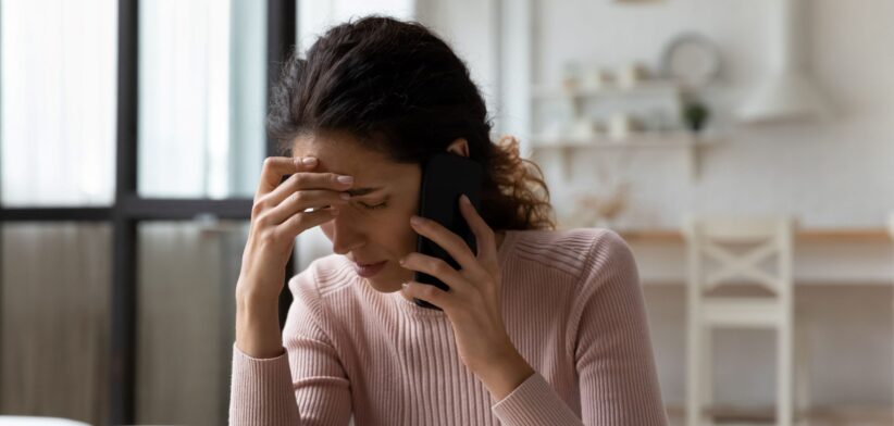 Sad woman on phone. | Newsreel