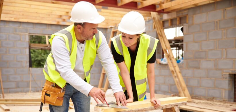 Builder with apprentice. | Newsreel