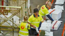 Australia Post parcel warehouse workers. | Newsreel