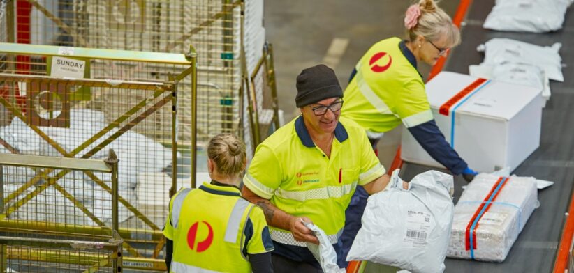 Australia Post parcel warehouse workers. | Newsreel