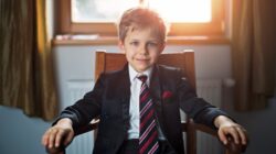 Boy in business suit. | Newsreel