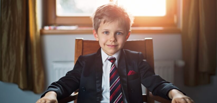 Boy in business suit. | Newsreel