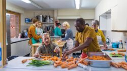 Workers in a community kitchen. | Newsreel