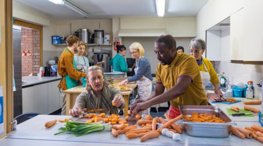 Workers in a community kitchen. | Newsreel