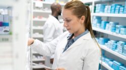 Pharmacist filling a prescription. | Newsreel