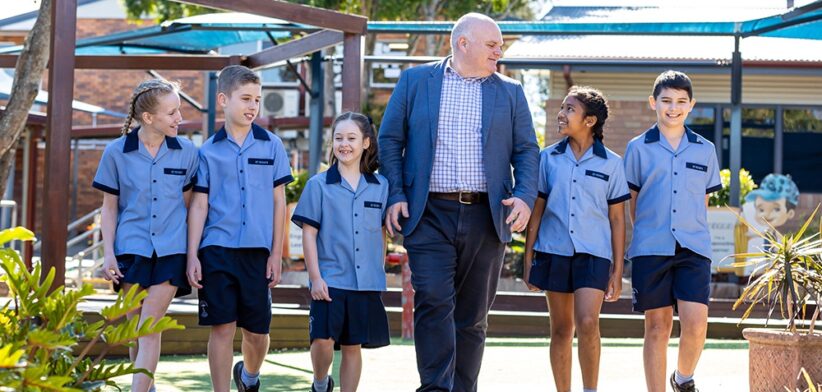 Principal Michael McInerney with students at St Peter's Primary School Rochedale. | Newsreel