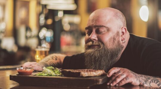 Man savouring steak meal. | Newsreel