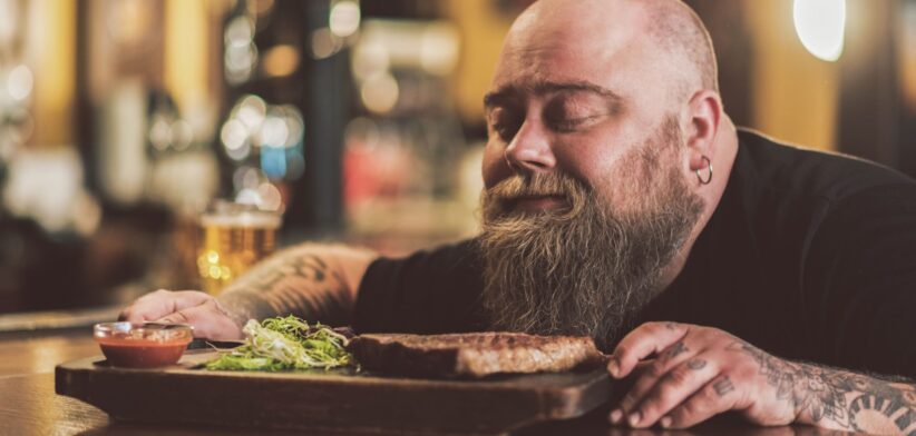 Man savouring steak meal. | Newsreel