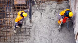 Concrete being poured on a construction site. | Newsreel