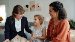 Support worker with mother and child. | Newsreel