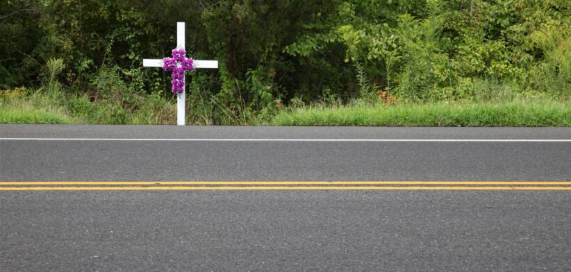 Cross by side of the road. | Newsreel