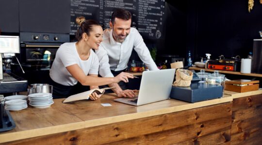 Small business owners on computer. | Newsreel