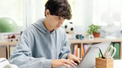 Student doing homework on computer. | Newsreel