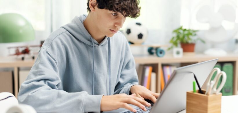 Student doing homework on computer. | Newsreel