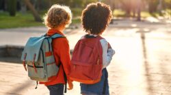 Young children walking to school. | Newsreel