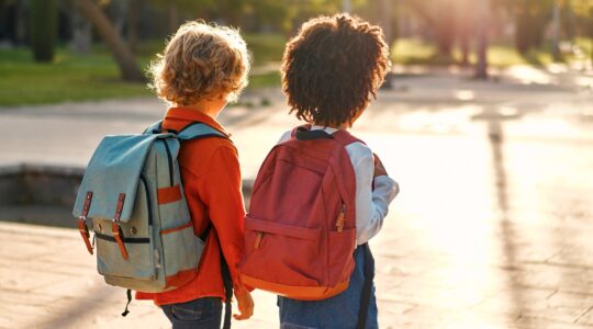 Young children walking to school. | Newsreel