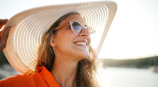 Woman being sun safe. | Newsreel