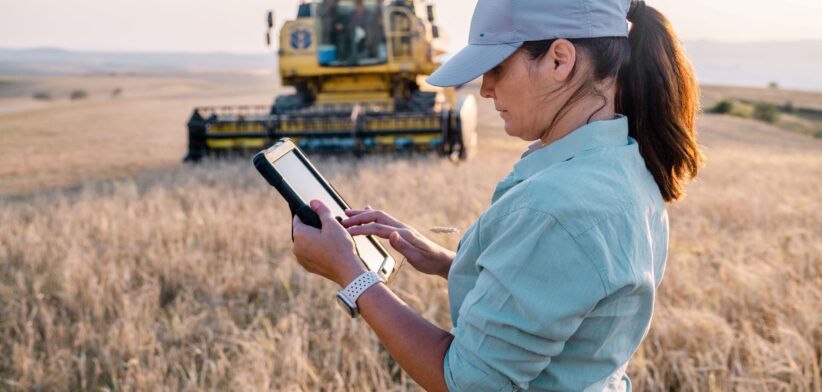 Farmer in field with tablet. | Newsreel