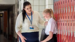 Teacher supporting upset student. | Newsreel