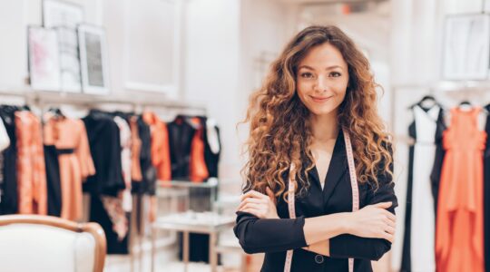 Clothes shop worker. | Newsreel