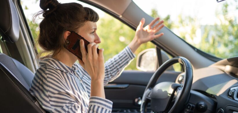 Woman on phone in car. | Newsreel