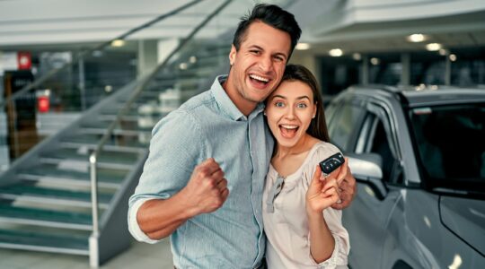 Couple buying a new car. | Newsreel