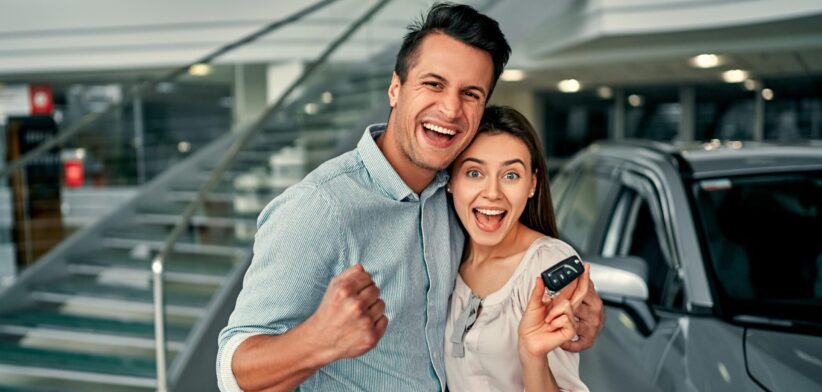 Couple buying a new car. | Newsreel