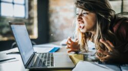 Woman angry at computer. | Newsreel