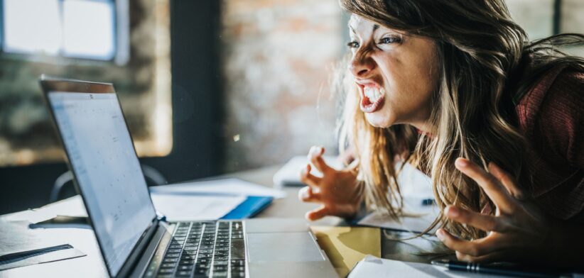 Woman angry at computer. | Newsreel