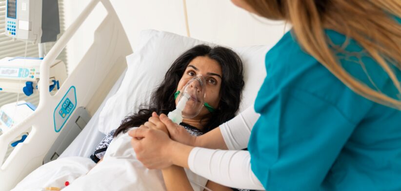 Woman on oxygen in hospital. | Newsreel