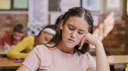 Unhappy student in classroom. | Newsreel