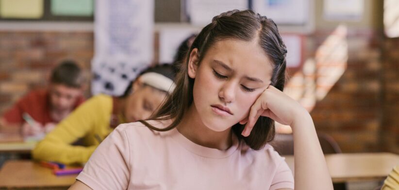 Unhappy student in classroom. | Newsreel