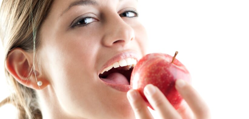 Woman eating apple. | Newsreel