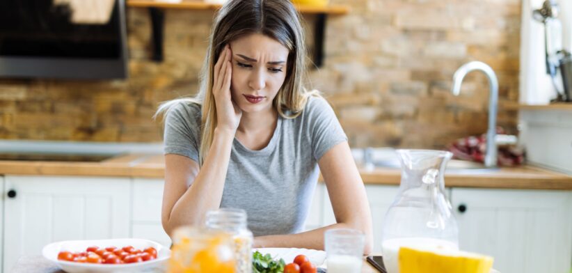 Woman sad eating food. | Newsreel