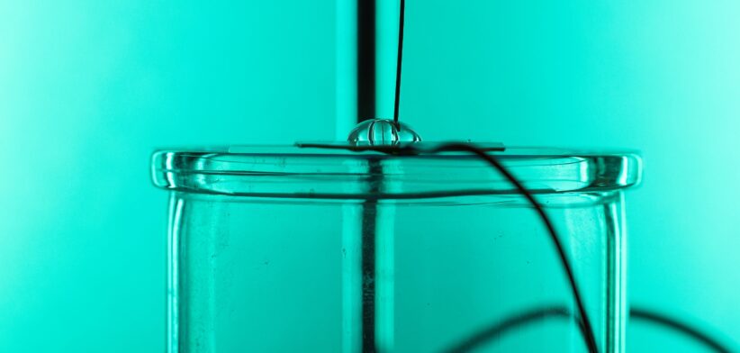 Water droplet with electrodes. | Newsreel