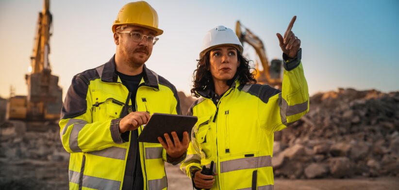 Man and woman on mining site. | Newsreel