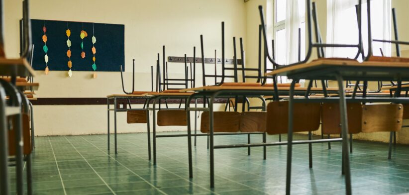 Classroom with chairs on desks. | Newsreel