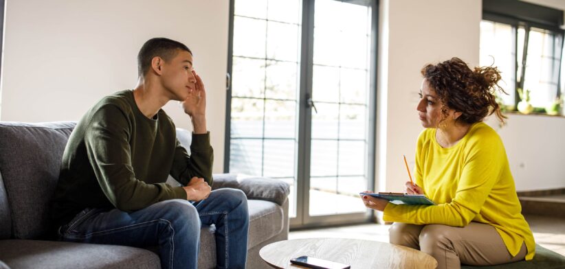 Young person with counsellor. | Newsreel