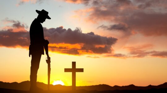 Soldier and cross remembering. | Newsreel