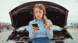 Woman with broken down car. | Newsreel