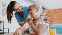 Elderly woman and care provider. | Newsreel