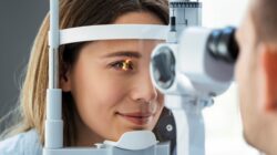 Woman receiving eye exam. | Newsreel