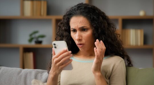 Woman worried looking at phone. | Newsreel