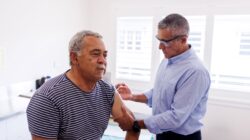 Aboriginal senior receiving an injection. | Newsreel