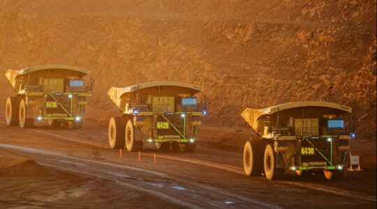 Mining trucks. | Newsreel