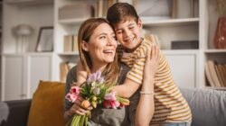 Mother and son with flowers. | Newsreel