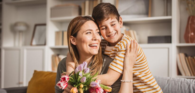 Mother and son with flowers. | Newsreel