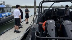 School students and Queensland Police Service boat. | Newsreel